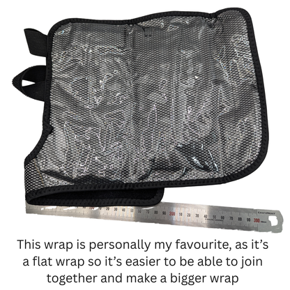 A black mesh fabric wrap with black trim and a small black loop tab, shown on a white background with a metal ruler underneath for scale and a text caption at the bottom.